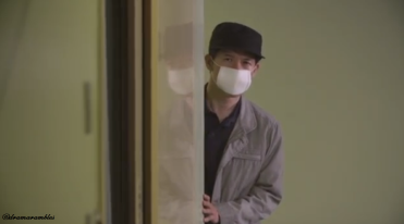 the surgical mask makes him more suspicious